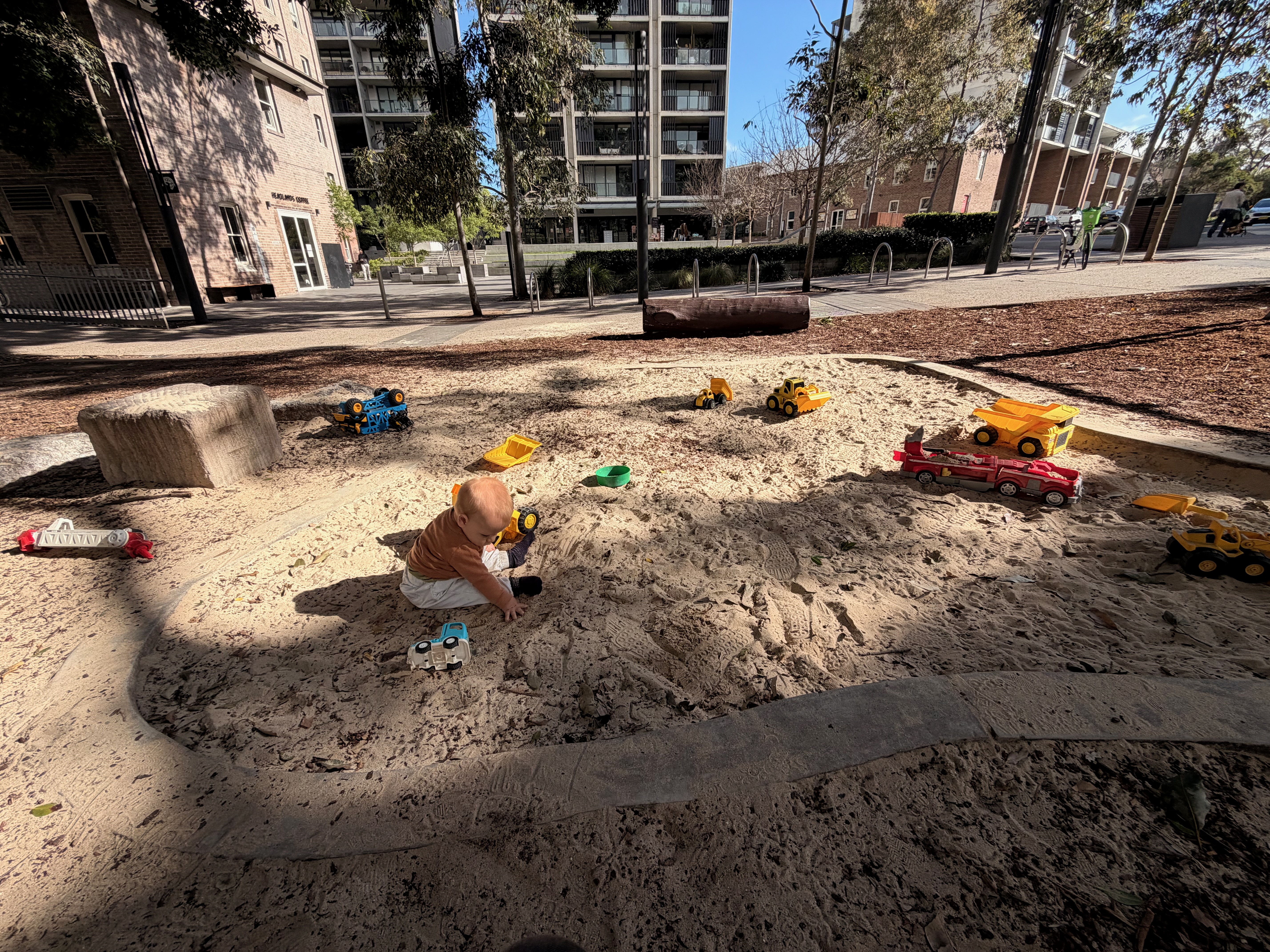A sandpit with toys